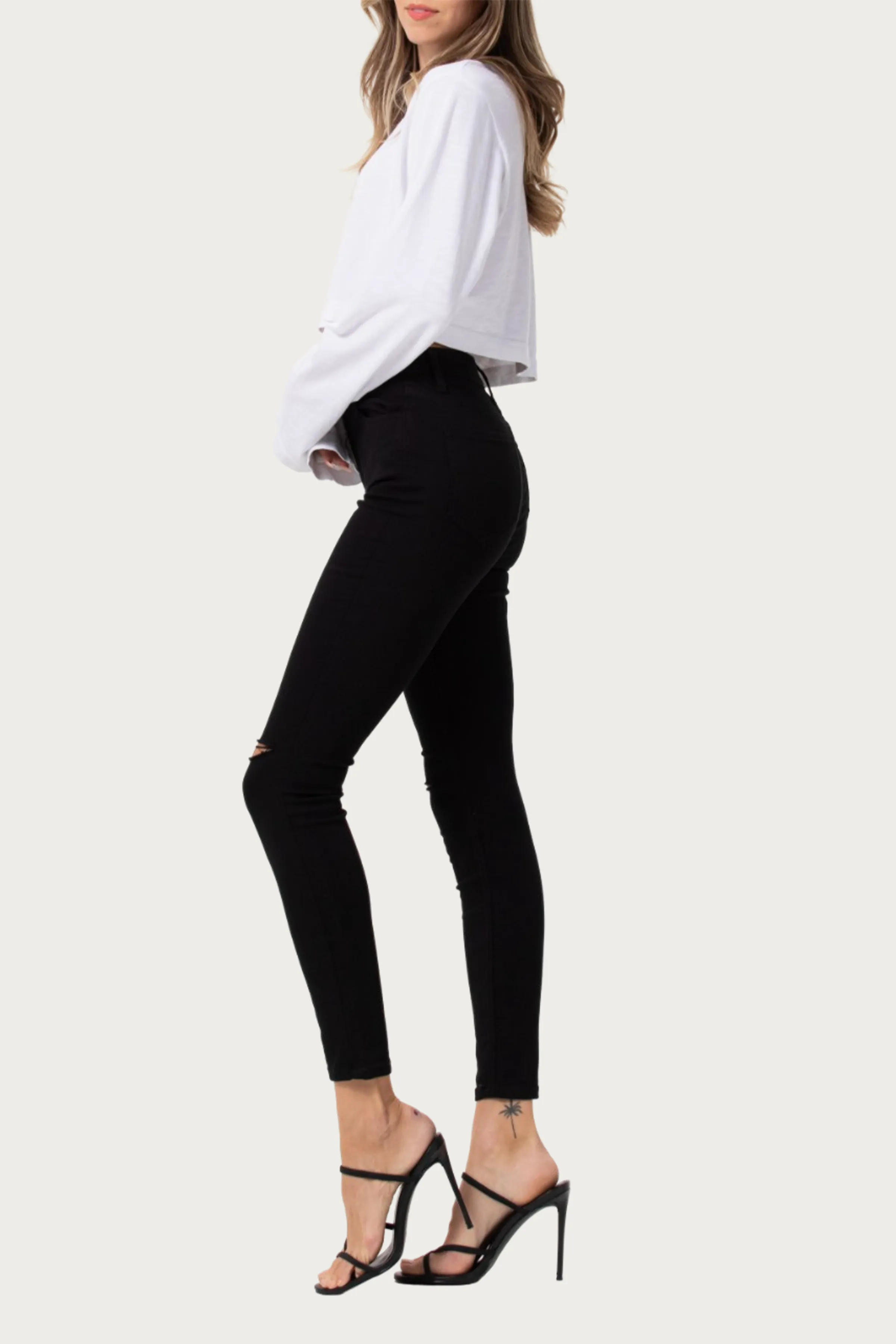 HIGH-RISE DISTRESSED SKINNY JEANS