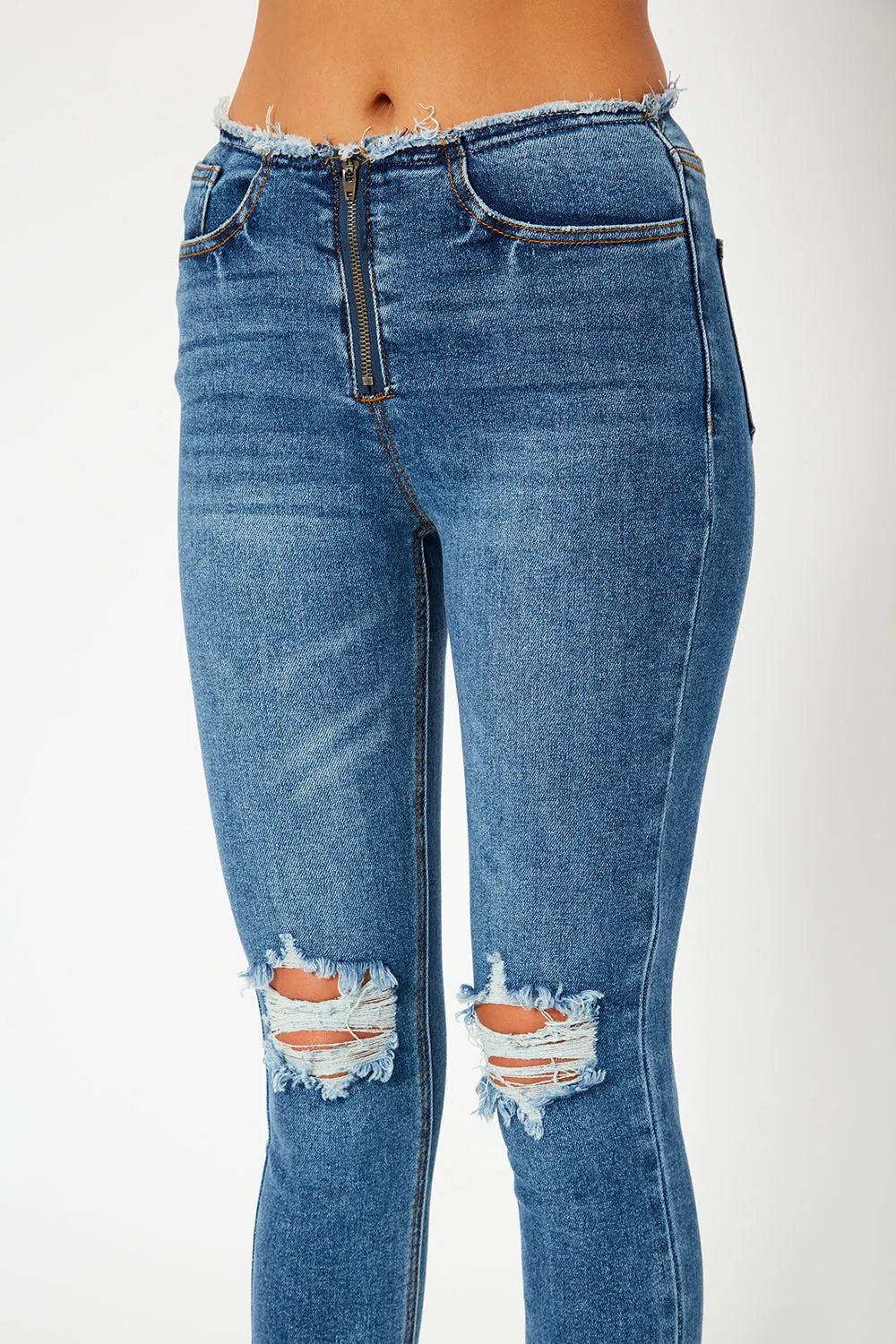 Mid-rise medium blue skinny jeans