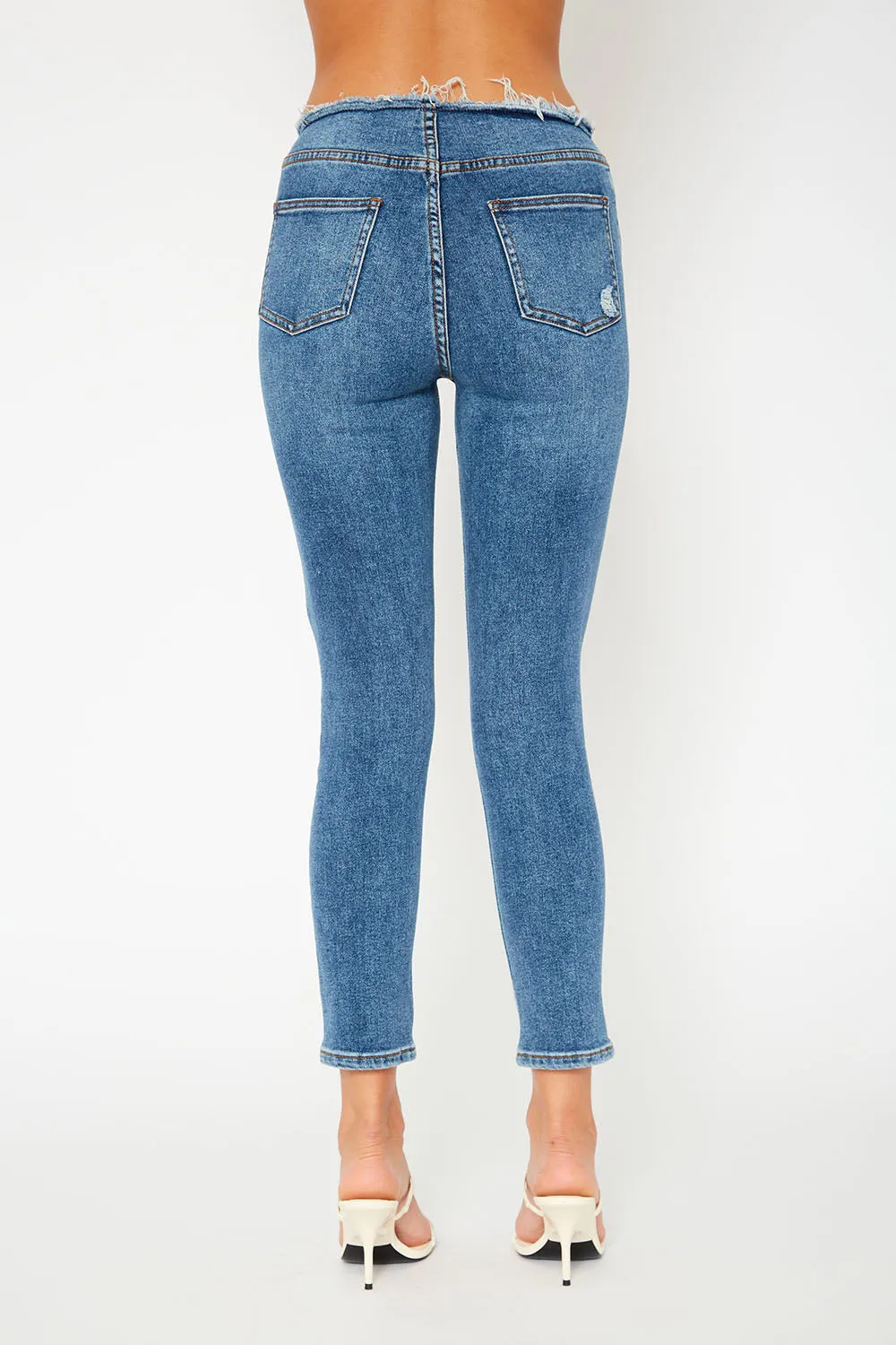 Mid-rise medium blue skinny jeans
