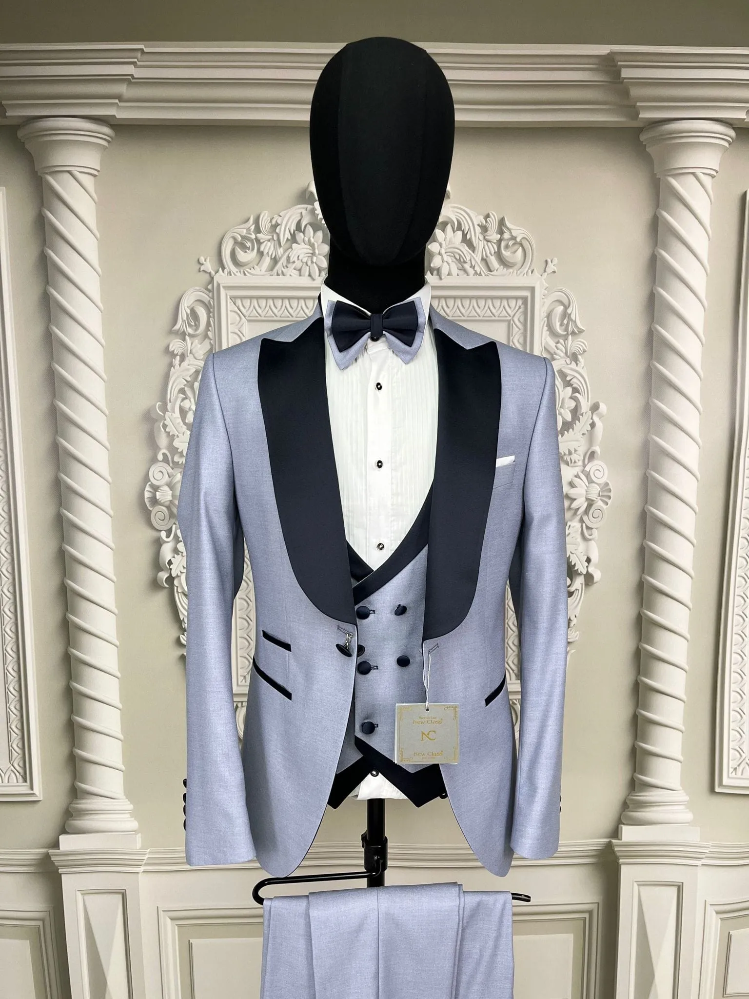 Single button three piece men's Suit with contrasting black velvet lapel, matching bow tie and Black Pants